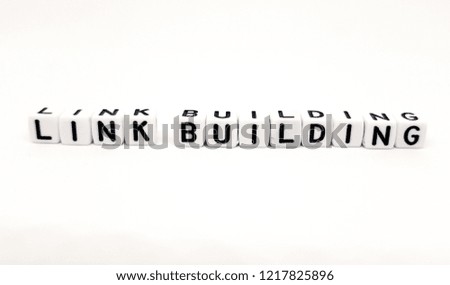 Link building word built with white cubes and black letters on white background