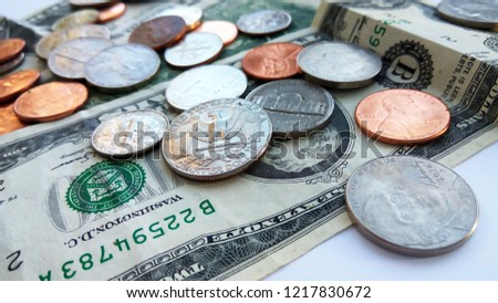 Close up American quarter, dime and penny coins on two dollars usa background