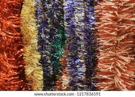 New Year photo of multi-colored tinsel. Christmas tree decorations