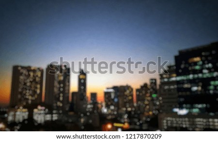 Blurred image of building, city scape, from top view. Evening light.