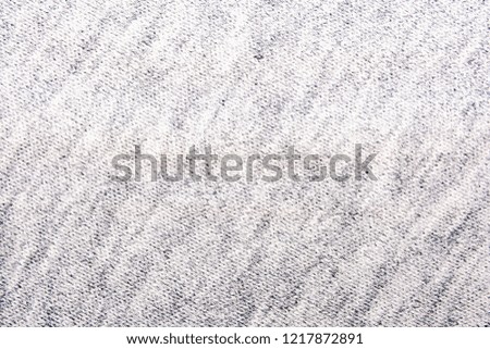 The texture of the knitted gray fabric for the background   