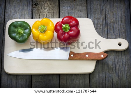 Paprika and knife on cutting board preparation for cooking