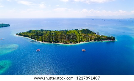 Gili Sudak in the middle of a blue ocean. Royalty-Free Stock Photo #1217891407