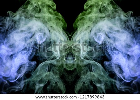 Green cloud of smoke of  black isolated background in the form of a skull, monster, dragon on a black isolated background. Mocap for cool t-shirts
