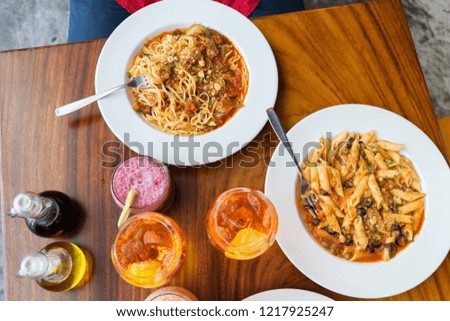 Italian pasta on a table in an Italian restaurant.