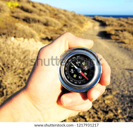 Orientation Concept a Male Hand Holding a Metal Compass