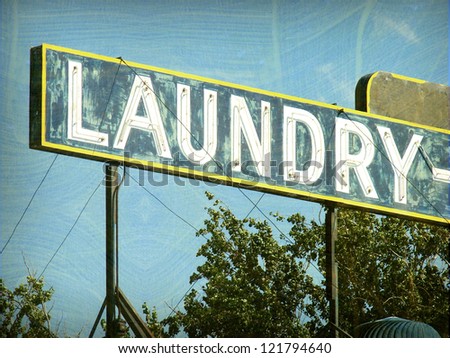 aged and worn vintage laundry sign