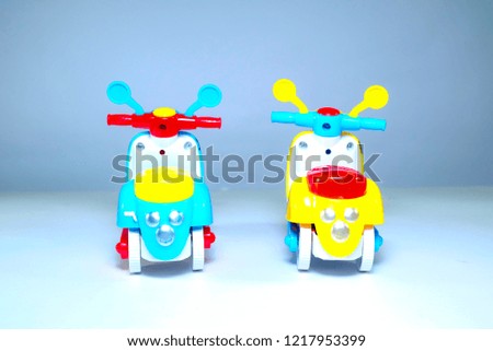 A picture of two scooters miniature bought by a kid from a toy shop.