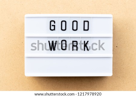 Light box with word good work on wood background