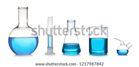 Set with different laboratory glassware and liquid for analysis on white background Royalty-Free Stock Photo #1217987842
