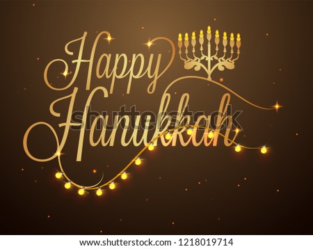 Happy Hanukkah lettering decorated with lighting garland on glossy brown background for Jewish Holiday celebration. Royalty-Free Stock Photo #1218019714