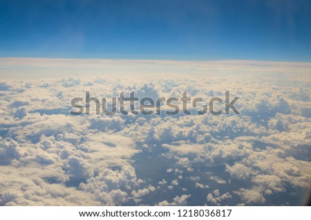 View from the airplane porthole. Top view of clouds.