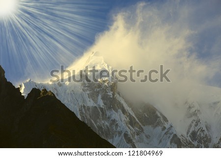 sun and wind toward to snow peak, Himalaya mountain