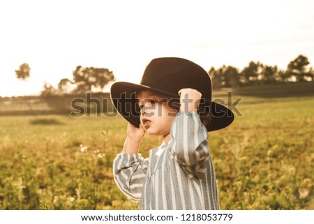 Portrait of a beautiful little girl with a hat. Kids with hats