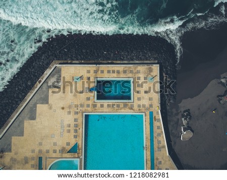 erial view from swimming pools near a beach. Drone shot. Azores island Portugal