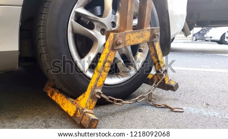 Wrecker towing car, vehicle fined for parking violations, evacuation service Royalty-Free Stock Photo #1218092068