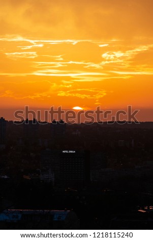 Burning sky sunset in Belgrade, Serbia, with Hotel Srbija neon sign 