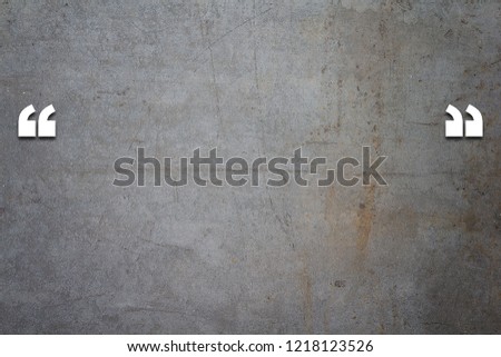 Quotation mark and copy space on grunge concrete texture background, communication concept