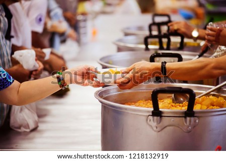 Hands-on food of the hungry is the hope of poverty : concept of homelessness Royalty-Free Stock Photo #1218132919