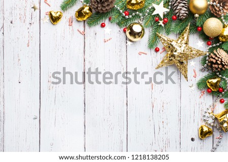 Christmas decoration, Christmas pine branch, pine cones and balls on white plank