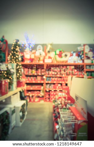 Vintage tone blurred abstract Christmas decorations supplies and accessories at hardware store in Texas, USA. Wide selection of lights, trees, decor, festive essentials