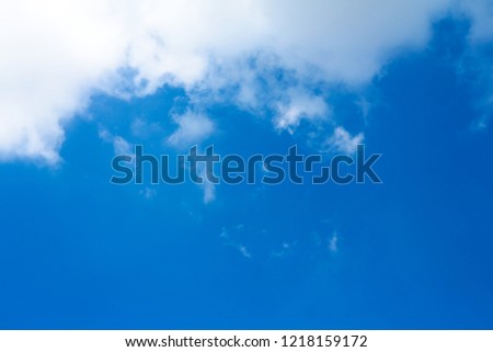 White bright cloud over clean blue sky in tropical area. For background or backdrop.