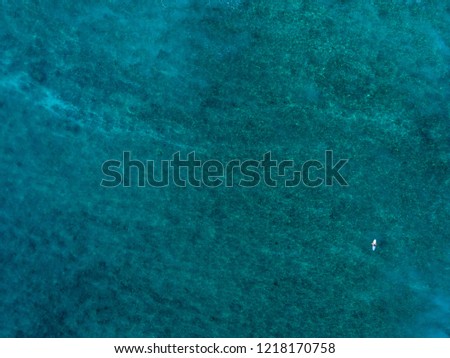 Ocean floor and surfer