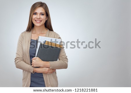 Happy shcool teacher holding books. Isolated professional portrait.