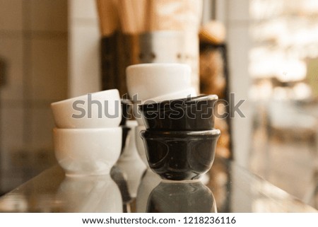Black and white bowls on a counter