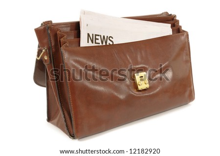 Old leather briefcase with newspaper business news headline isolated on white background