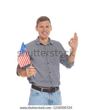 Portrait of man holding USA flag on white background