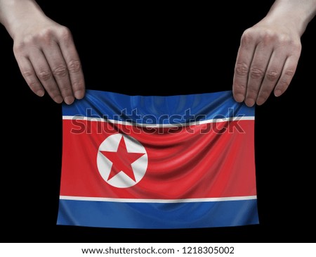 North Korean flag in hands
