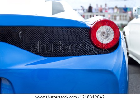 blue sports car spot light. Detail of a luxury car