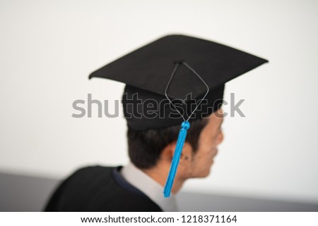 Graduates wear black hats on graduation day at the university.