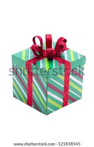 Extreme close-up shot of Christmas gift box with ribbon knot over white background.