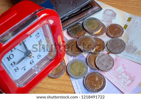 Clock, coins, banknotes, pocket money.
