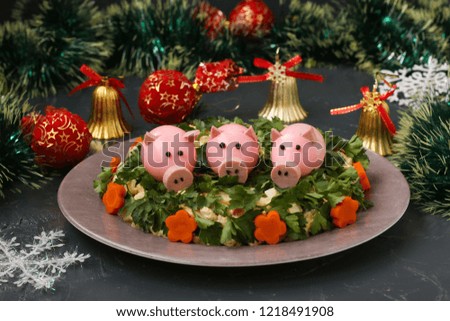 Boiled eggs, piglets, made from eggs, sausage and black pepper, an idea for children. Festive Salad decorated Boiled Egg pigs 