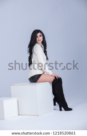 Beauty fashion portrait of young beautiful brunette girl with long black hair. Beauty face. portrait of beautiful girl with long hair on white. Studio photo.