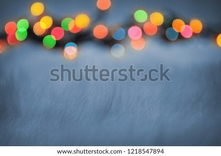 Blurred Christmas Lights Behind Snowlike Texture