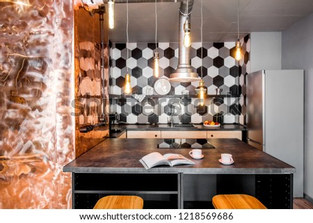 Modern loft kitchen room made in pink and grey colors with copper wall and hexagonal tiles