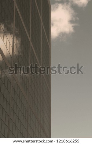 Concept of business and global commerce. High building, skyscraper against beautiful sky and clouds with reflections in windows. 
