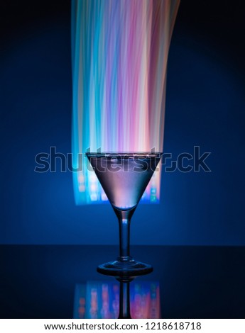 Martini glass on the background of neon lights