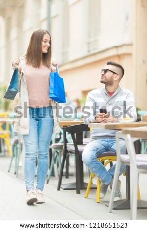 Young couple in cafe outdoors 