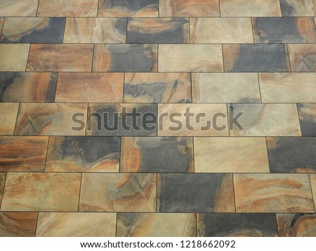 Stone wall background. Marble facing tiles. Flat surface for background, space for text