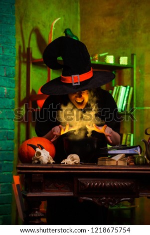 Image of witch of saucepans with magic potion