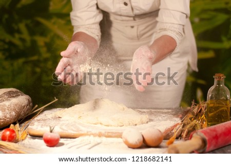 woman hands the dough in the kitchen