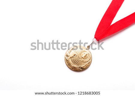 Gold medal with red ribbon on white background. Isolated. Copy space