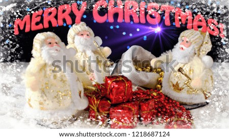 Three funny toys Santa Clauses musicians with their gifts on the snow and the inscription Merry Christmas on a glowing background. Colorful greeting card for Christmas.