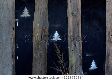 wooden background, on a dark background stencil tree,