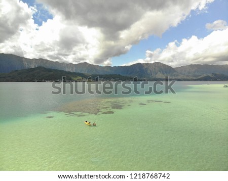 Beautiful picture showing a kayak in the waters of Kaneohe Bay, Oahu, Hawaii